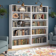 a white bookcase with lots of books on it