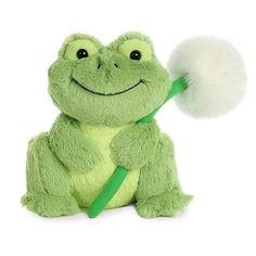 a green frog stuffed animal with a white pom - pom