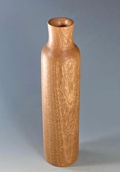 a wooden vase sitting on top of a table