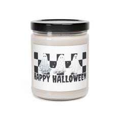 a jar of happy halloween candles on a white background