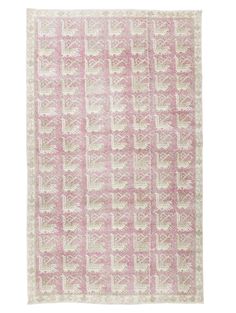 a pink and white rug on a white background