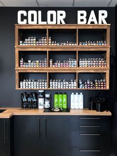 a coffee shop with black walls and wooden shelves