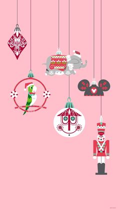 christmas ornaments hanging from the ceiling in pink and red colors, with an elephant on top