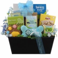 a basket filled with lots of goodies for someone's baby shower or birthday