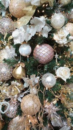 a christmas tree with gold and silver ornaments