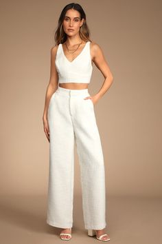 Transition into sunny days in style with Lulus Chic and Sophisticated Ivory Tweed Wide-Leg Pants! Woven tweed shapes these ultra-trendy pants that have a high, banded waist and a flowy fit with side seam pockets and ankle-length hems. Hidden top button and zipper fly. Pair with the matching tank top for a complete look! Fit: This garment fits true to size. Length: Floor length. Size medium Inseam: 29.00 Front Rise: 12.75 Waist: Fitted - very fitted at natural waist. Hip: Fitted - consider sizing High Waisted Trouser Pants, Button Midi Skirt, Tweed Pants, Tailored Clothes, Trendy Pants, Bridal Separates, Cute Blouses, Top Cropped, Top Crop