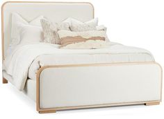 a bed with white sheets and pillows on it's headboard, in front of a white background