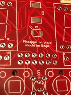 a close up view of the inside of a red circuit board