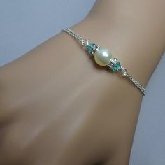 Items similar to Ivory Pearl and Light Turquoise Bridesmaid Bracelet, Swarovski Ivory Pearl and Light Turquoise Crystal Bridesmaid Bracelet, Bridesmaid Gift on Etsy Turquoise Bridesmaid, Turquoise Crystal, Bridesmaid Bracelet, Ivory Pearl, Beaded Bracelets Diy, Light Turquoise, Bead Jewellery, Wedding Bracelet