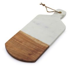 a white and brown cutting board with a wooden handle