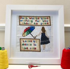 there is a framed picture with an image of a woman holding an umbrella and the words don't waste time waiting for the rain to pass