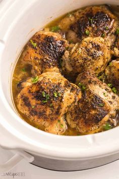 chicken thighs in a white slow cooker