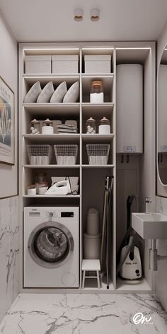 a washer and dryer in a small room with marble flooring on the walls