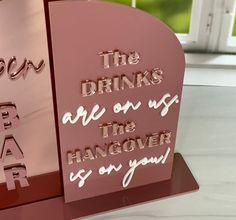 there is a sign that says the drinks are on the hangover so you can