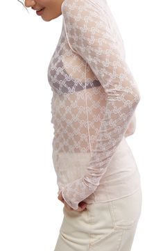 Love to layer in this sheer T-shirt made of stretchy floral lace and sweetened by a dainty satin bow at the neck. 27" length (size Medium) Boat neck Long sleeves Sheer 83% nylon, 17% elastane Hand wash, dry flat Imported Sheer Stretch Lace Top, Spring Lace Mesh Top For Layering, Spring Fitted Lace Mesh Top, Sheer Stretch Lace Top For Layering, Stretch Lace Mesh Top, Fitted Lace Tops For Layering, Fitted Delicate Lace Top For Spring, Feminine Fitted Mesh Top, Fitted Lace Mesh Top For Spring