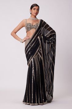 Buy Black Georgette Potters Touch Border Half Saree With Unstitched Blouse Piece For Women by Masaba Online at Aza Fashions. Black Mirror Work Saree, Party Wear Pre-draped Saree With Mirror Work For Navratri, Black Embellished Georgette Saree, Designer Wear Embellished Black Saree, Designer Black Embellished Saree, Designer Embellished Black Saree, Black Sequined Saree For Reception, Glamorous Black Embellished Saree, Festive Black Embellished Pre-draped Saree