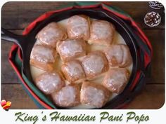 a pan filled with food sitting on top of a wooden table