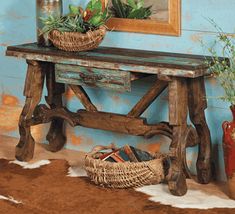 a wooden bench with baskets on top of it in front of a blue painted wall