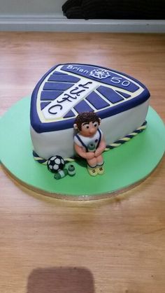 there is a cake with a soccer theme on it