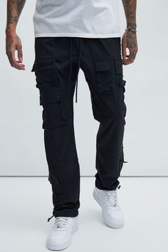 Model Height: 6'2 - Waist: 32 - Wearing Large Big & Tall: Height 6'3 - Waist 42 - Wearing XXXL Available In Black. Runs Small, Shop One Size Up Elastic Waist With Drawstring Side Hand Pockets Back Pocket Cargo Pockets Drawstring At Ankle Shell: 97% Nylon 3% Spandex Imported | Mens Versatile Cargo Pants in Black size Large by Fashion Nova Black Cargo Pants Outfit Men, Black Cargo Pants Outfit, Plain Hoodies, Mens Fashion Blazer, Black Cargo Pants, Black Cargo