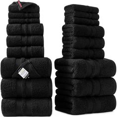 a stack of black towels sitting next to each other