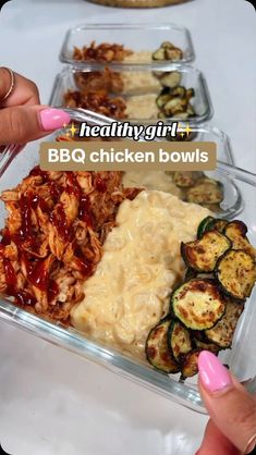 a person is holding a plastic container with food in it and the words healthy girl bbq chicken bowls