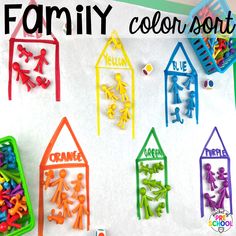 the family color sort is displayed in front of some plastic houses and people with letters on them