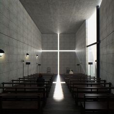 the inside of a church with pews and lights shining down on it's walls