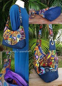 the purse is blue and has multicolored designs on it, along with an attached shoulder strap