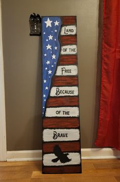 an american flag with the words land of the free because of the brave painted on it