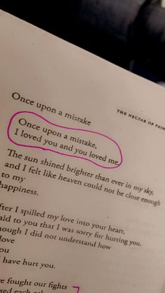 an open book with writing on it and a pink marker in the bottom corner that says, once upon a miskake i loved you and you