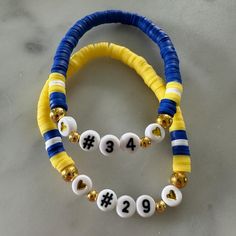 two bracelets that have numbers on them