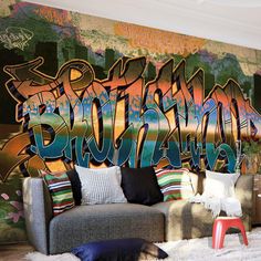 a living room with graffiti on the wall