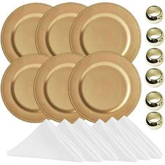 gold dinnerware set with napkins and forks