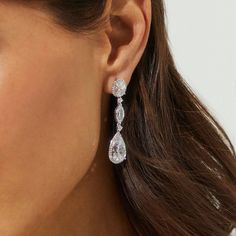 The mix of oval and pear-shaped cubic zirconia stones add a modern twist to these classically chic and elegant drop earrings. A favorite for weddings and special occasions, these stunning beauties sparkle from every angle in an understated way. Elegant Silver Teardrop Marquise Earrings, Elegant Marquise Teardrop Earrings For Wedding, Droplet Earrings, Wedding Earring, Crystal Bridal Earrings, Linking Rings, Rocker Chic, Chic And Elegant, Threader Earrings