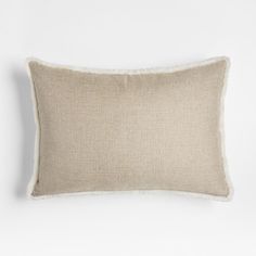 the linen pillow is made from natural materials and has white piping on it, along with