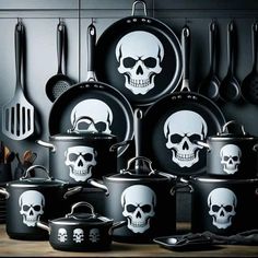 a bunch of pots and pans with skulls on them