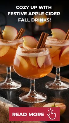 three glasses filled with apple cider and cinnamon sticks