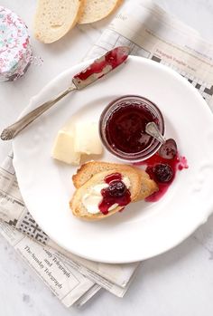 a white plate topped with bread and jelly