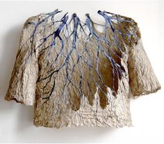 a t - shirt with blue and brown branches on it