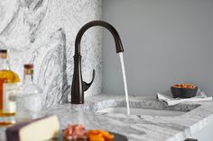 With an elegant, versatile design, this Bellera® faucet offers exceptional functionality for a bar sink or secondary kitchen sink. The high-arch spout swivels 180 degrees, giving you wide coverage for food and drink prep and simplifying cleanup. KOHLER Bellera Oil-Rubbed Bronze Single Handle Bar and Prep Kitchen Faucet | K-29107-2BZ Secondary Kitchen, Bar Sink, Prep Kitchen, Kitchen Handles, A Bar, Kitchen Faucet, Oil Rubbed Bronze, Kitchen Sink, Faucet