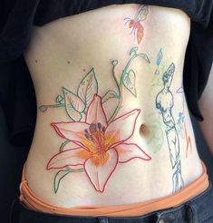 a woman with tattoos on her stomach has a flower painted on the side of her belly