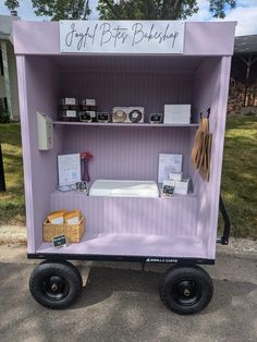 a purple cart with some items on it