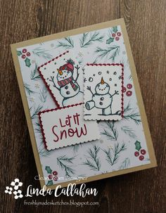 a card with two snowmen on it and the words let it snow written in red