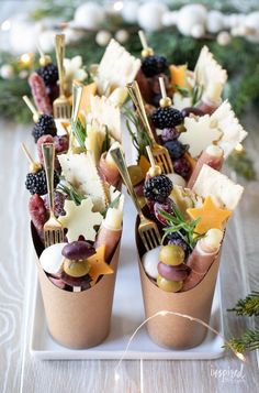 small cups filled with different types of food