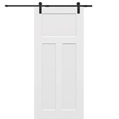 an open white door with black hardware on the top and bottom, against a white background