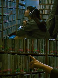 a woman with headphones on in front of a book shelf filled with books and cds