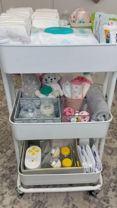 a baby changing table with lots of items in it