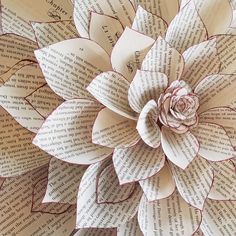 a paper flower made out of book pages