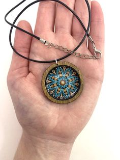 This is a beautiful hand made necklace, painted on a decorative wooden bezel using acrylic paints. Topped with UV resin for a long lasting protective finish.  This necklace cord measures up to 18" in length with a 2" extender chain and lobster clasp.  All my necklaces are lead and nickle free! Pendant itself measures 1.5" in diameter and .2" thick. RETURN POLICY: Unfortunately I can not duplicate an item if it is damaged. If you are unhappy with your item, I will refund the full amount upon the Mandalas, Dot Mandalas, Hand Painted Necklace, Necklace Cord, Using Acrylic Paint, Wood Pendant, Dot Art, Tealight Candle Holders, Uv Resin